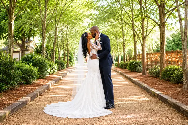 Long Hollow Gardens bride groom kiss walkway