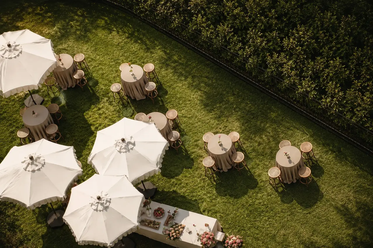Cocktail hour reception under umbrellas
